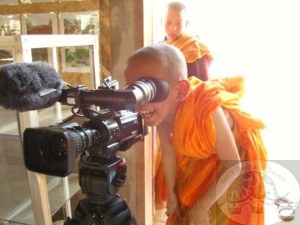 movies at the temple - novice looking through a camera