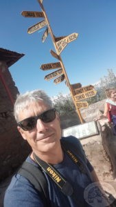 signpost on taquil island lake titicaca