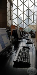 computers on desk in library